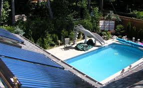 Peak view of pool and solar panels